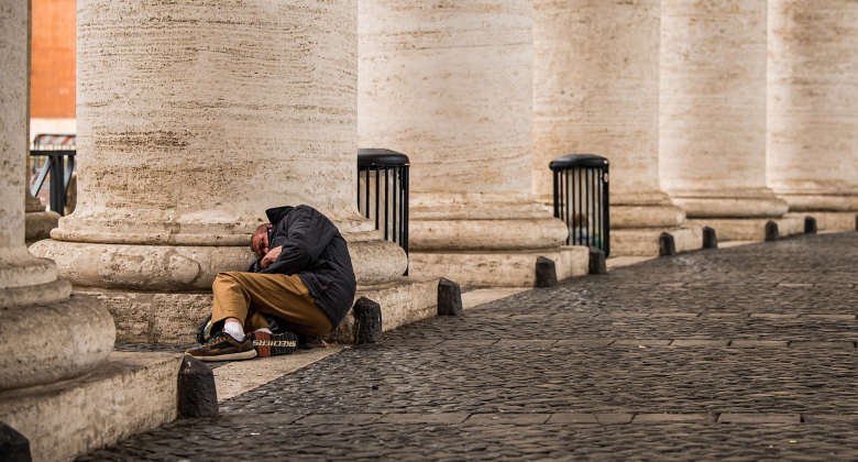 homeless man sleeping in public